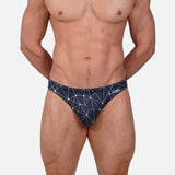 Model wearing Bikini Caio Brazilian swim brief in Stellar Ash (dark gray)