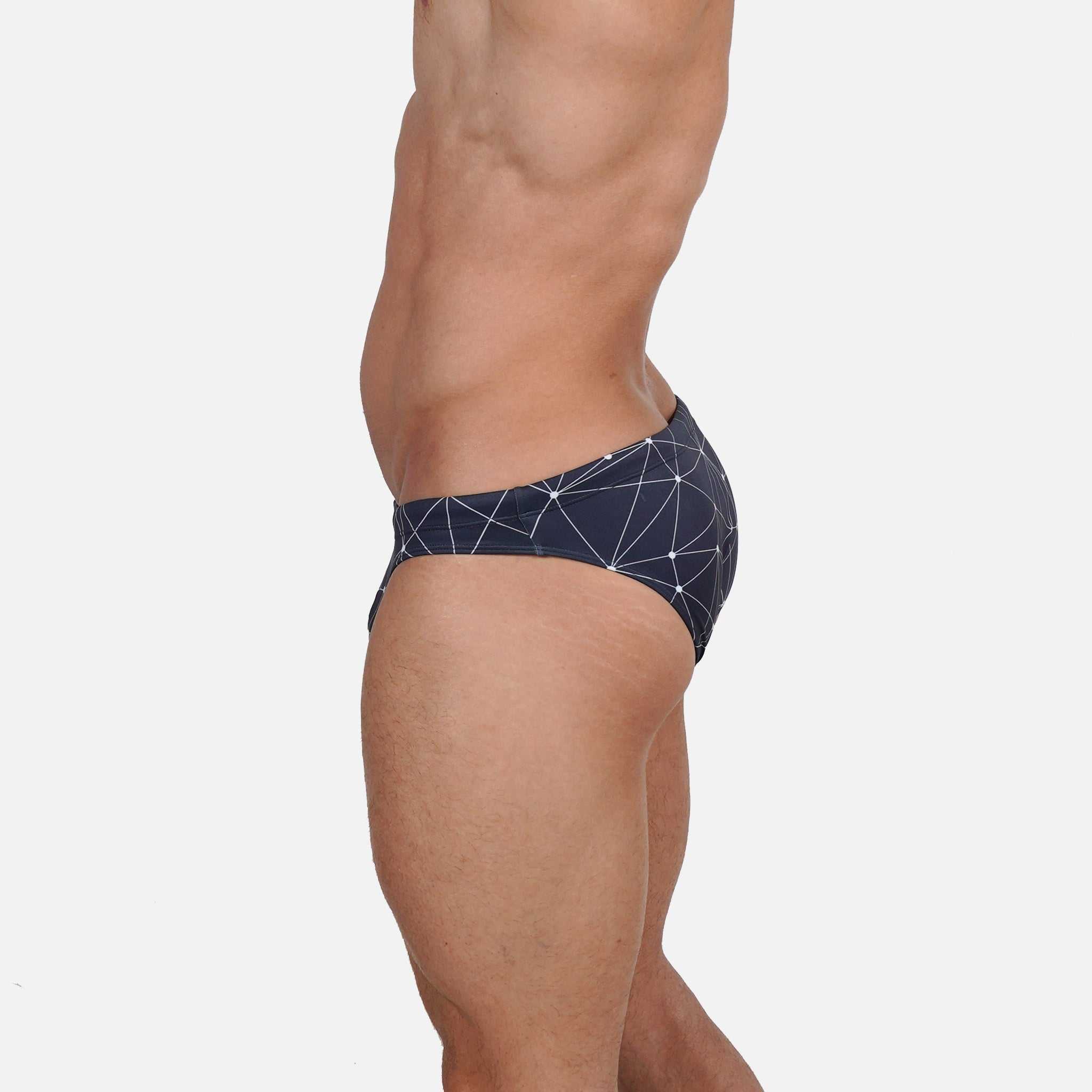 Model wearing Bikini Caio Brazilian swim brief in Stellar Ash (dark gray)