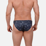 Model wearing Bikini Caio Brazilian swim brief in Stellar Ash (dark gray)