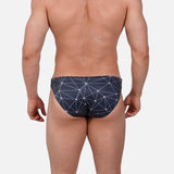 Model wearing Bikini Caio Brazilian swim brief in Stellar Ash (dark gray)