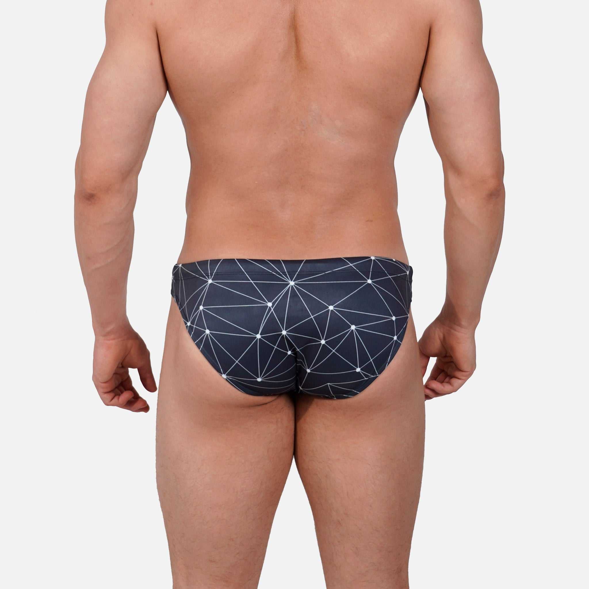 Model wearing Bikini Caio Brazilian swim brief in Stellar Ash (dark gray)
