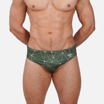 Model wearing Slim Caio Brazilian swim brief in Astro Moss (olive green)
