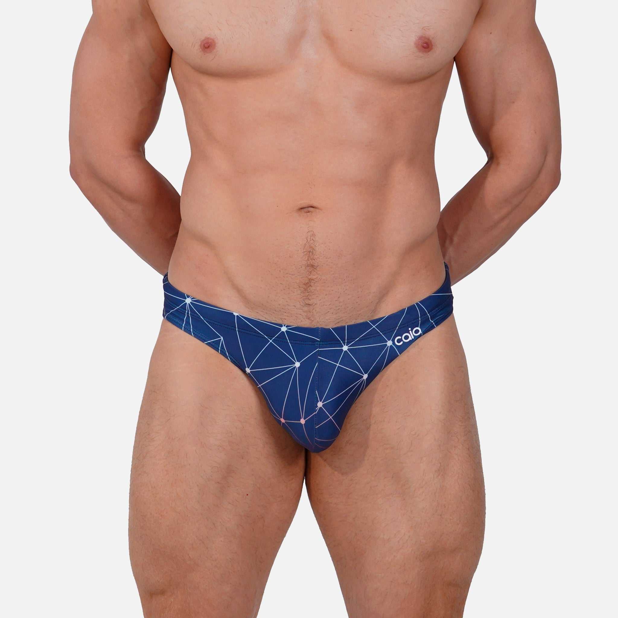 Model wearing Bikini Caio Brazilian swim brief in Celestial Azure (blue)