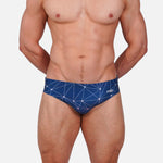 Model wearing Slim Caio Brazilian swim brief in Celestial Azure (blue)