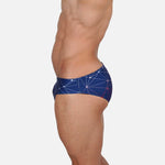 Model wearing Slim Caio Brazilian swim brief in Celestial Azure (blue)