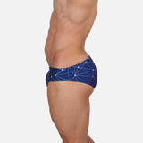 Model wearing Slim Caio Brazilian swim brief in Celestial Azure (blue)