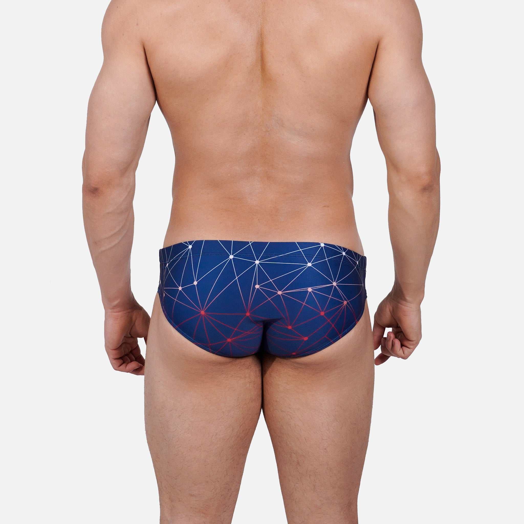 Model wearing Slim Caio Brazilian swim brief in Celestial Azure (blue)