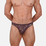 Model wearing Bikini Caio Brazilian swim brief in Astral Soil (Brown)