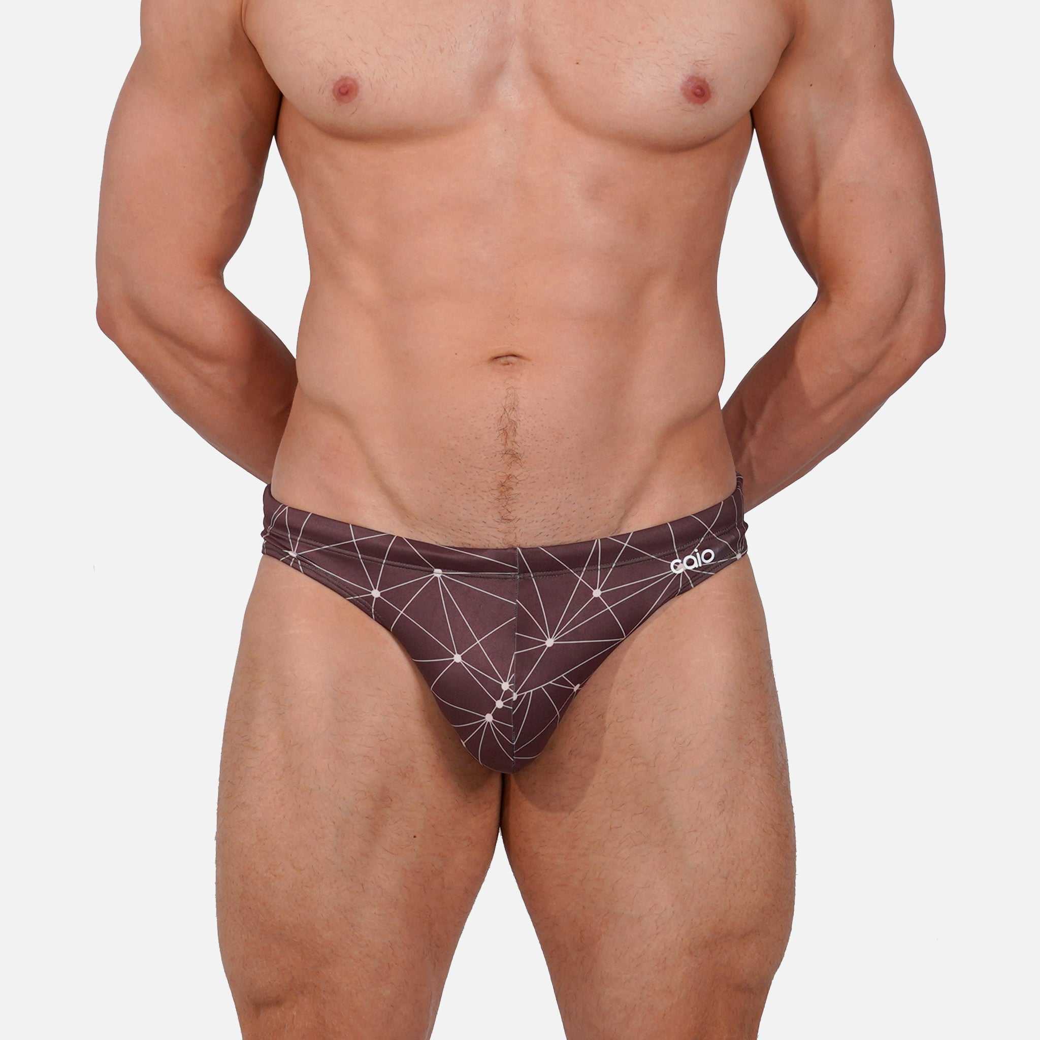 Model wearing Bikini Caio Brazilian swim brief in Astral Soil (Brown)