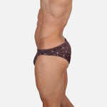 Model wearing Bikini Caio Brazilian swim brief in Astral Soil (Brown)