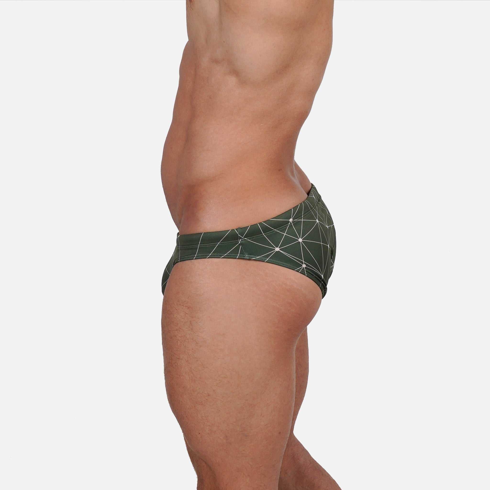 Model wearing Bikini Caio Brazilian swim brief in Astro Moss (olive green)