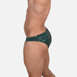 Model wearing Bikini Caio Brazilian swim brief in Starwood