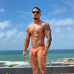 model wearing solar flare bikini by Caio with a blue sky background