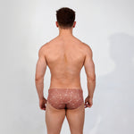 model posing for a studio photo wearing Caio Classic Cosmic Cocoa Swim Brief