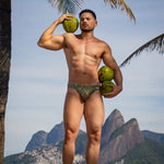 Model wearing Bikini Caio Brazilian swim brief in Astro Moss (olive green)