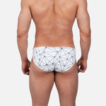 Model wearing Slim Caio Brazilian swim brief in Nova Frost (white)