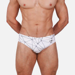 Model wearing Slim Caio Brazilian swim brief in Nova Frost (white)