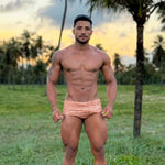 Filipe wearing classic cosmic cocoa swim brief outdoors