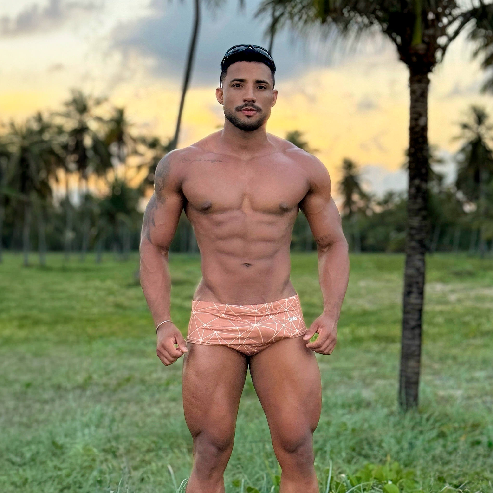 Filipe wearing classic cosmic cocoa swim brief outdoors